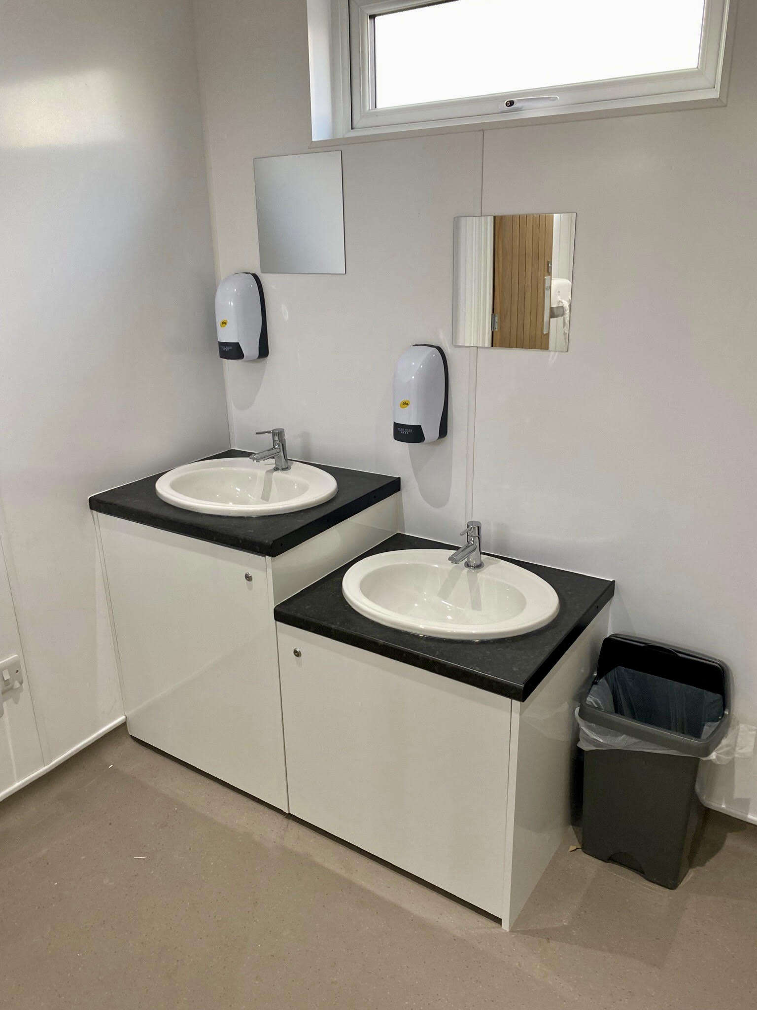 Modern toilet block with showers and washing facilities.